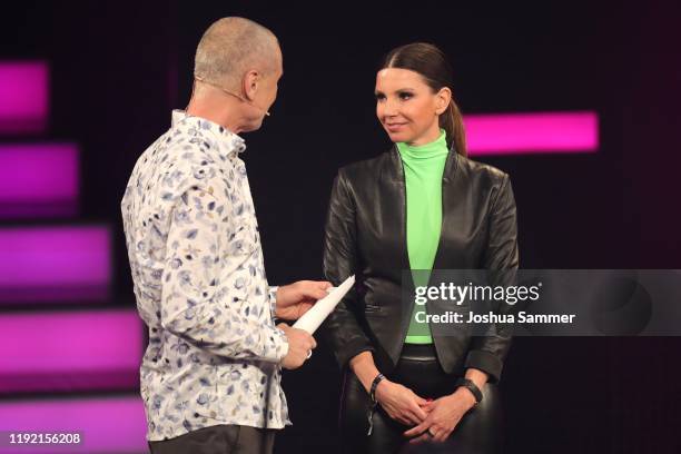 Juergen Domian and 'Special' award winner Teresa Enke of the Robert-Enke-Fund speak on stage at the 1Live Krone radio award at Jahrhunderthalle on...