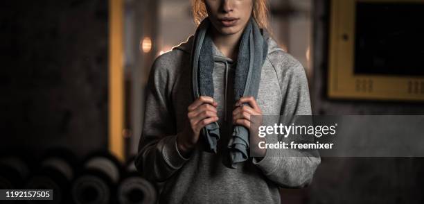 young female athlete standing in gym - towel stock pictures, royalty-free photos & images