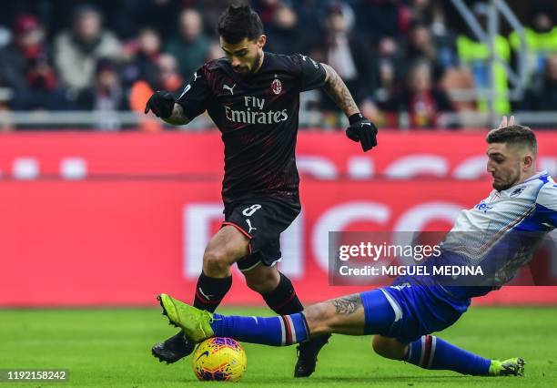 Sampdoria's Italian defender Nicola Murru tackles AC Milan's Spanish forward Suso during the Italian Serie A football match AC Milan vs Sampdoria on...