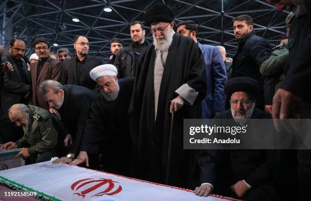 Iranian Supreme Leader Ayatollah Ali Khamenei , Iranian President Hassan Rouhani and Iranian Parliament Speaker Ali Larijani attend the funeral...