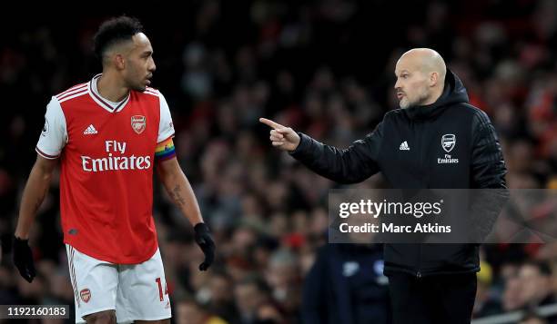 Head coach Freddie Ljungberg of Arsenal speaks to Pierre Emerick Aubameyang of Arsenal during the Premier League match between Arsenal FC and...