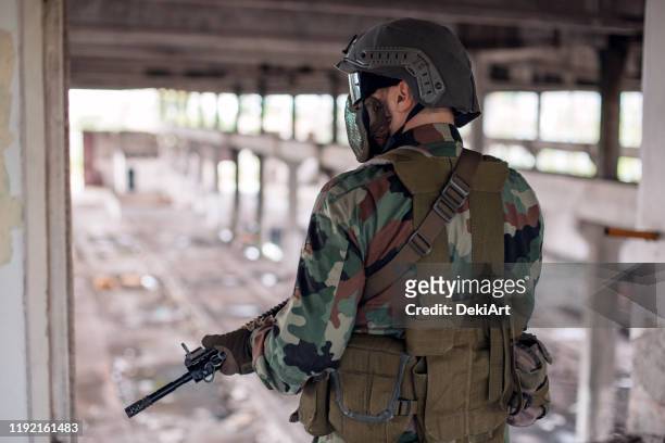 army soldier in war zone - airsoft gun stock pictures, royalty-free photos & images