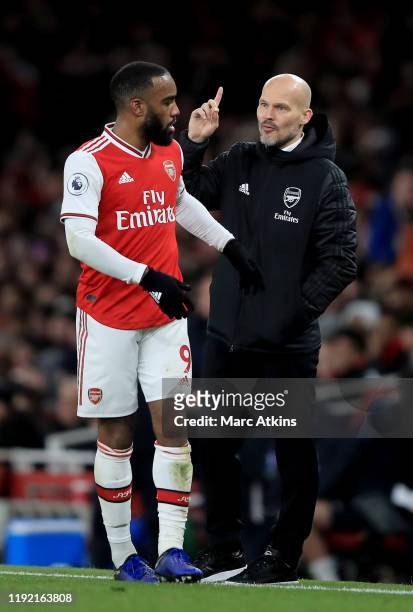 Head coach Freddie Ljungberg of Arsenal speaks to Alexandre Lacazette of Arsenal during the Premier League match between Arsenal FC and Brighton &...