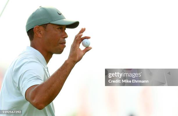 Tiger Woods of the United States reacts to a putt on the 18th hole during the second round of the Hero World Challenge at Albany on December 05, 2019...