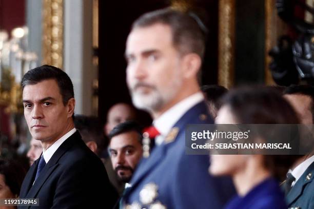 Spanish caretaker prime minister, socialist Pedro Sanchez , Spain's King Felipe VI and Spain's Queen Letizia attend the Spanish army celebration...