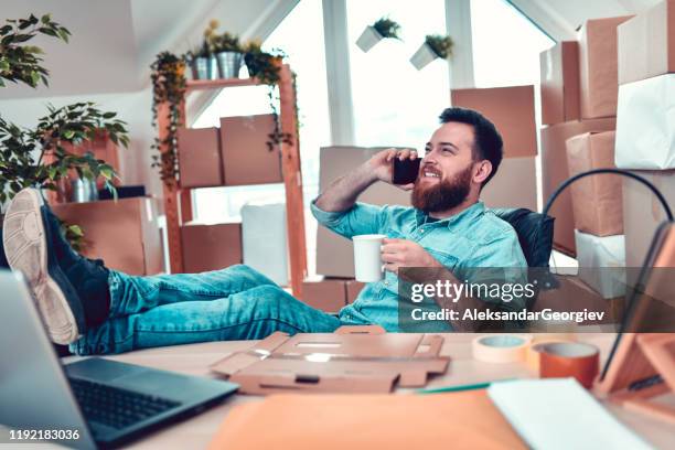 happy office worker arranging new delivery dates via phone call - sending stock pictures, royalty-free photos & images