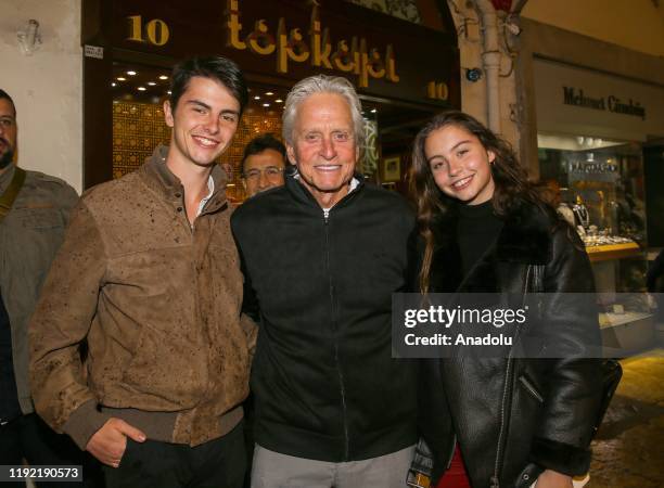 American actor and producer Michael Douglas poses for a photo with his daughter Carys and son at Grand Bazaar on the 3rd day of their holiday in...