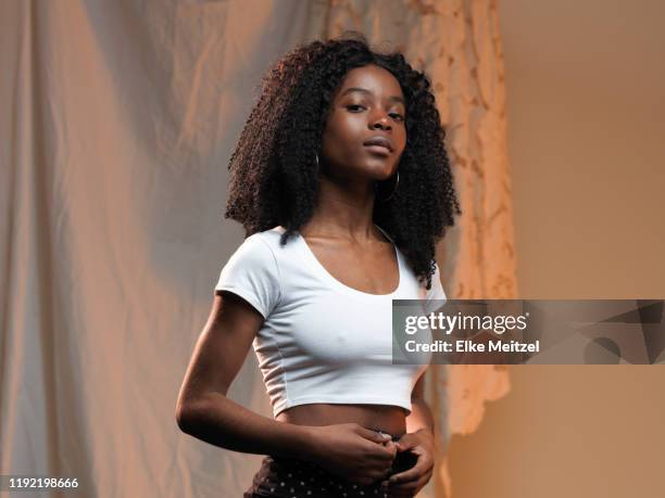 young woman with attitude - raised eyebrows stock pictures, royalty-free photos & images