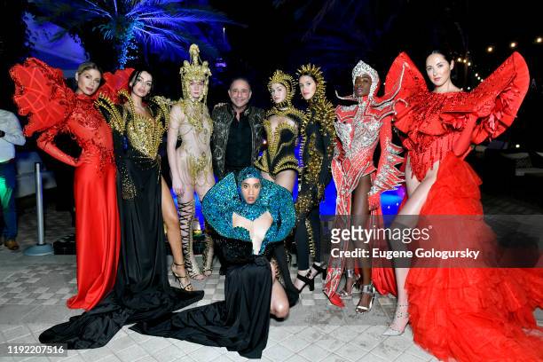 Models poses with designer Jacob Meir of For The Stars Fashion House during celebration of InList's new app launch during Art Basel Miami 2019 at...