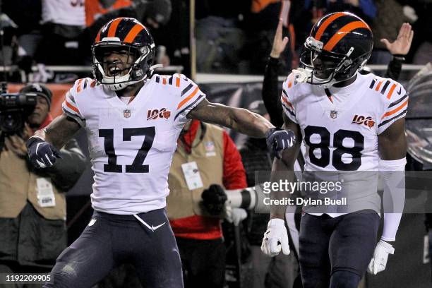 Anthony Miller and Riley Ridley of the Chicago Bears celebrate after Miller scored a touchdown in the third quarter against the Dallas Cowboys at...