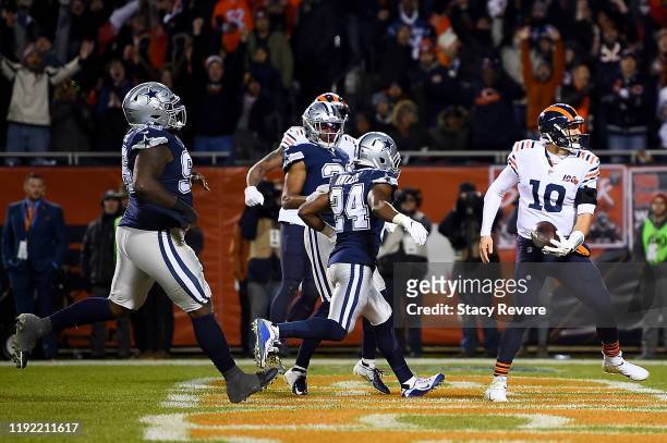 Quarterback Mitchell Trubisky of the Chicago Bears celebrates rushing for a touchdown over the defense of the Dallas Cowboys in the fourth quarter of...