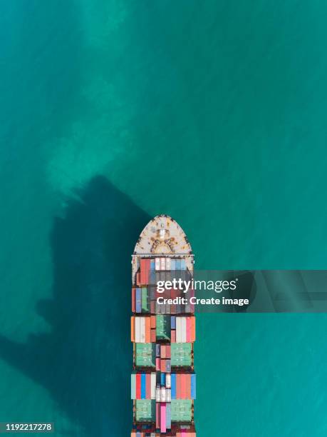 aerial top view container cargo ship carrier container on the sea for logistics business, import export, shipping or transportation. - shipping container top view - fotografias e filmes do acervo