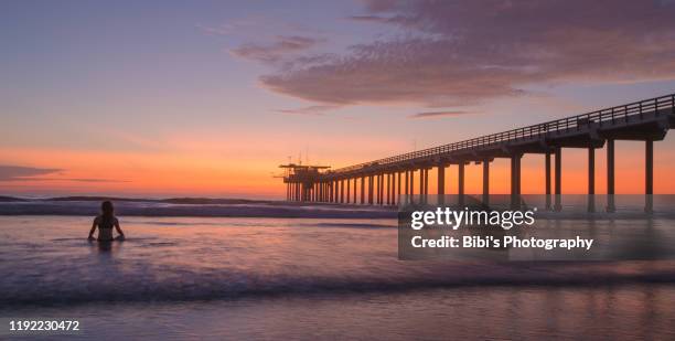 yoga woman in the la jolla beach sunset - san diego bridge stock pictures, royalty-free photos & images