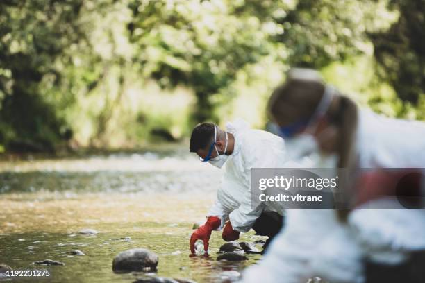 ecological water sampling - roupa protetora imagens e fotografias de stock
