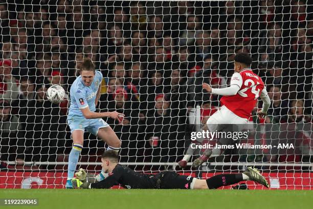 Reiss Nelson of Arsenal scores a goal to make it 1-0 during the FA Cup Third Round match between Arsenal and Leeds United at Emirates Stadium on...