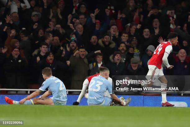 Reiss Nelson of Arsenal celebrates after scoring a goal to make it 1-0 during the FA Cup Third Round match between Arsenal and Leeds United at...