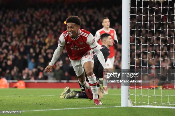 Reiss Nelson of Arsenal celebrates scoring the opening goal during the FA Cup Third Round match between Arsenal and Leeds United at Emirates Stadium...