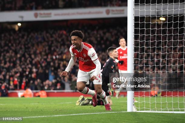 Reiss Nelson of Arsenal celebrates scoring the opening goal during the FA Cup Third Round match between Arsenal and Leeds United at Emirates Stadium...