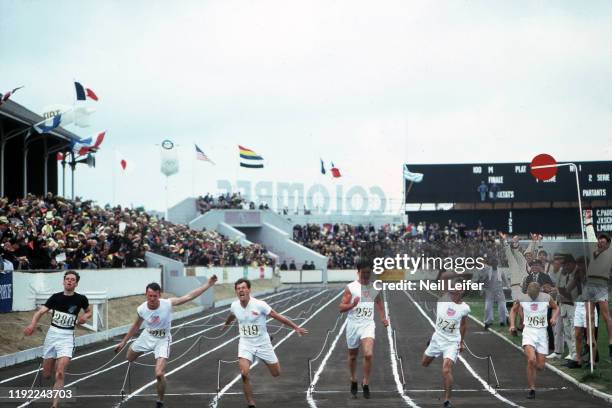 Actor Ben Cross, as runner Harold Abrahams in action, at finish line with actor Brad Davis as runner Jackson Scholz during photo shoot on the set of...