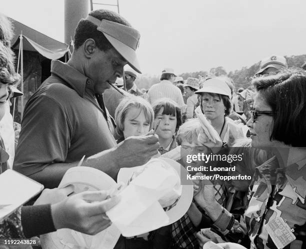 Lee Elder, the first Afro-American to compete at the US Masters Golf Tournament, at the Augusta National Golf Club in Georgia, signing autographs,...