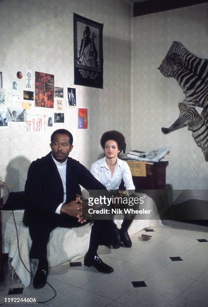 Author and political activist Eldridge Cleaver and his wife, professor and activist Kathleen Cleaver, sit on sofa of their Paris apartment during his...