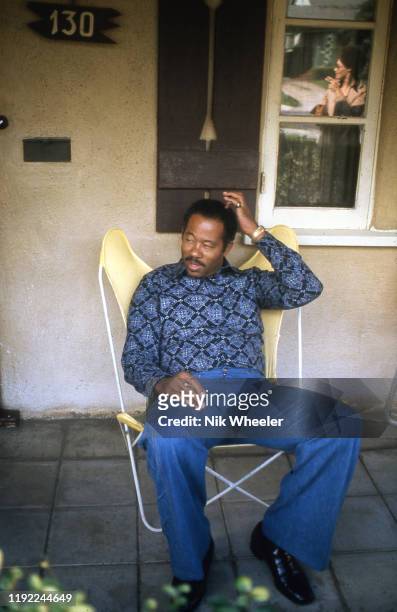 Black Panther leader and former Information Minister sits on chair on porch of his home, after breaking with the Black Panther Party, in Altadena...