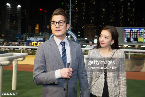 December 4 : Canto-pop superstar Aaron Kwok Fu-shing and his wife Moka Fang Yuan celebrate after Dancing Fighter winning the Race 9 Australia...