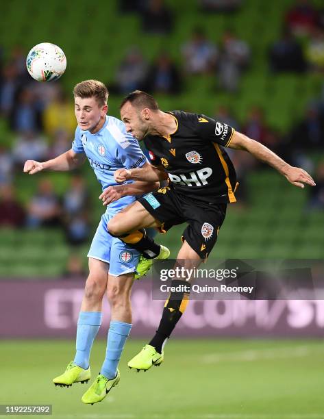 Connor Metcalfe of Melbourne City and Ivan Franjic of Perth Glory compete for the ball during the round nine A-League match between Melbourne City...
