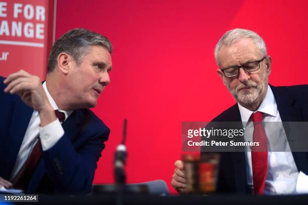 Labour politician Keir Starmer and Labour leader Jeremy Corbyn talk onstage during a campaign speech on December 6, 2019 in London, England. Mr...