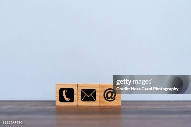 contact us symbols on toy blocks - icons for email mail and phone stock pictures, royalty-free photos & images