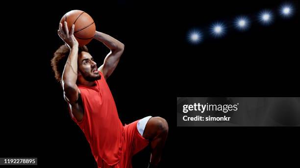 young man playing basketball - throwing stock pictures, royalty-free photos & images
