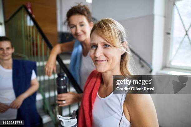 portrait of a confident mature woman in a health club - gym friends stock-fotos und bilder