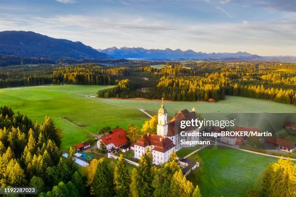 wieskirche in the morning light, pilgrimage church to the scourged saviour on the wies, wies, near steingaden, pfaffenwinkel, aerial view, upper bavaria, bavaria, germany - wieskirche stock-fotos und bilder