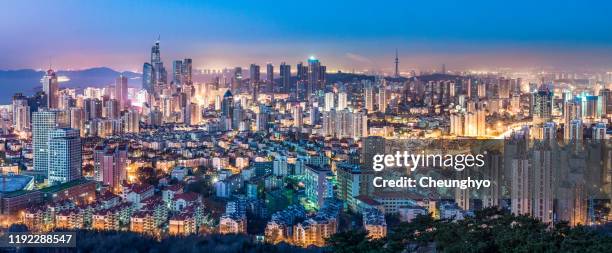 qingdao city skyline at dawn - qingdao beach stock pictures, royalty-free photos & images