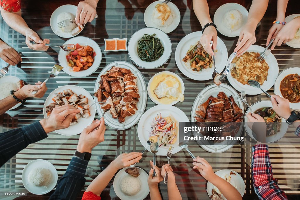 Asian chinese family enjoy their home made food during chinese new year's eve reunion dinner