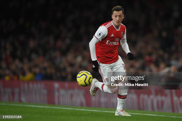 Mesut Ozil of Arsenal in action during the Premier League match between Arsenal FC and Brighton & Hove Albion at Emirates Stadium on December 05,...