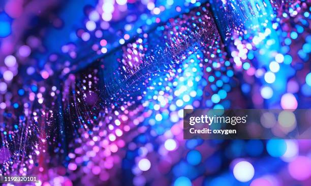 abstract neon multicolored beams bokeh purple blue background, motion light - light party ストックフォトと画像