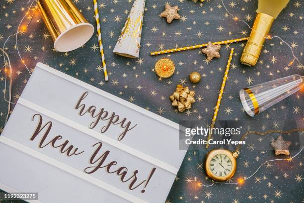 happy new year message in lightbox in golden party background.top view - new year 2019 stock-fotos und bilder