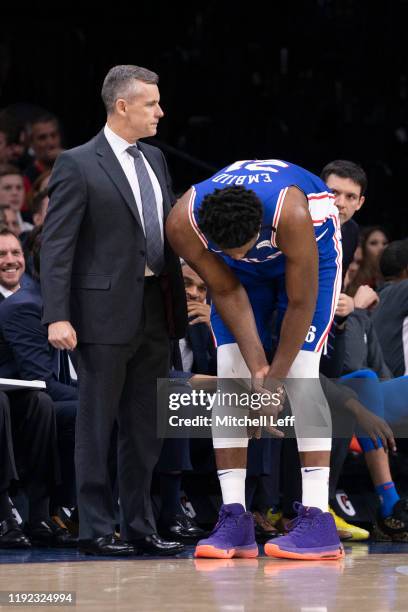 Head coach Billy Donovan of the Oklahoma City Thunder looks on as Joel Embiid of the Philadelphia 76ers reacts after injuring his finger in the first...