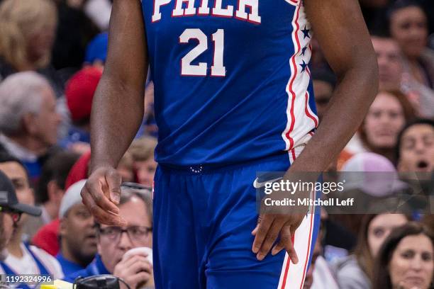 Joel Embiid of the Philadelphia 76ers walks off the court after injuring his finger in the first quarter against the Oklahoma City Thunder at the...