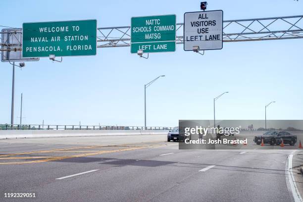 Florida State Troopers block traffic over the Bayou Grande Bridge leading to the Pensacola Naval Air Station following a shooting on December 06,...