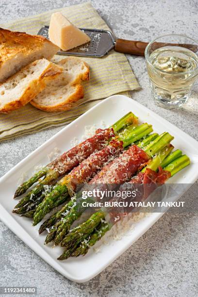 prosciutto wrapped asparagus - covered food with wine stock pictures, royalty-free photos & images