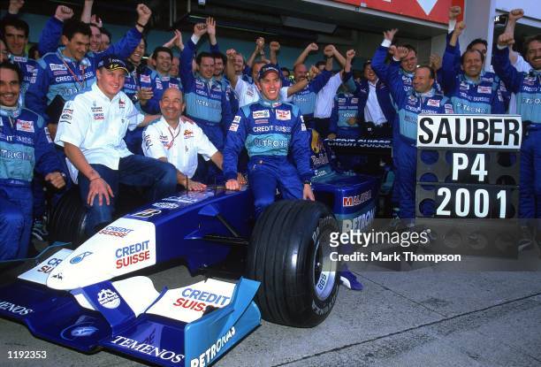 Sauber drivers Nick Heidfeld and Kimi Raikkonen celebrate 4th place in the Constructors Championship with Boss Peter Sauber after the Formula One...