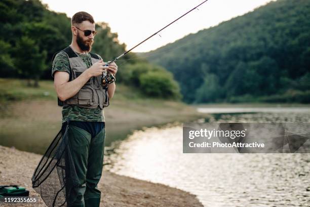 young man fishing - fisherman isolated stock pictures, royalty-free photos & images