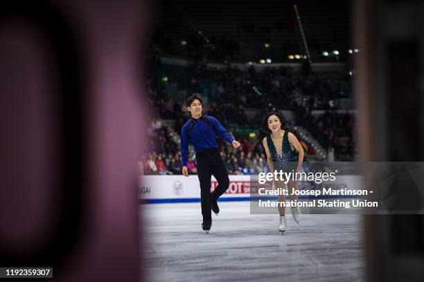 Wenjing Sui and Cong Han of China react after the Pairs Free Skating during the ISU Grand Prix of Figure Skating Final at Palavela Arena on December...