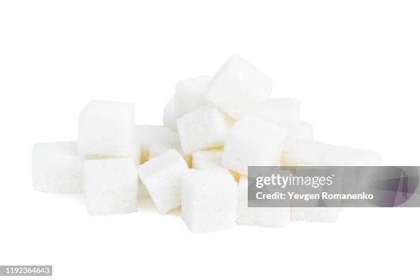 white sugar cubes isolated on white background - zucker stock-fotos und bilder