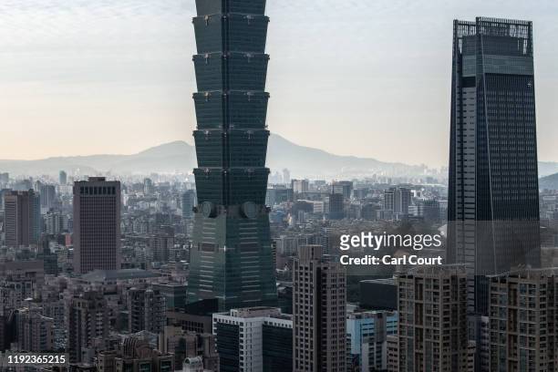 The Taipei 101 tower, once the worlds tallest building, and the Taipei skyline, are pictured from the top of Elephant Mountain on January 7, 2020 in...