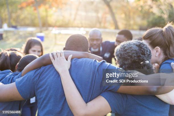 unified team of volunteers - social issues stock pictures, royalty-free photos & images