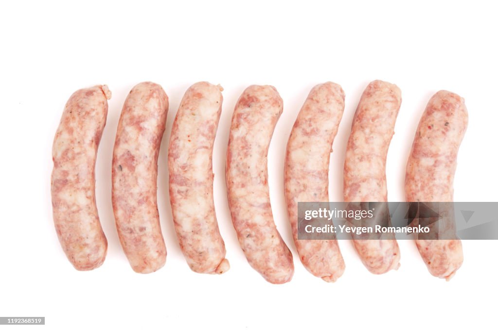 Raw sausage isolated on white background