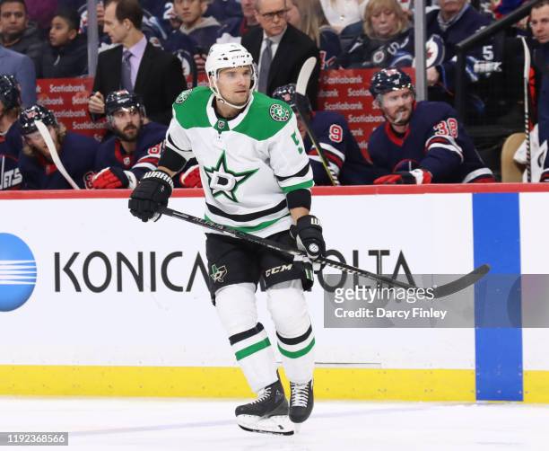 Andrej Sekera of the Dallas Stars keeps an eye on the play during third period action against the Winnipeg Jets at the Bell MTS Place on December 3,...